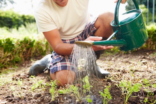 Image showing a gardener reviewing a service complaint