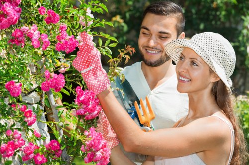 Worker reviewing garden safety before maintenance begins
